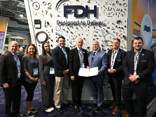 Executives from FDH Aero, FDH Electronics, Stealth Aerospace and Cinch Connectivity celebrating the agreement at the Paris Air Show.